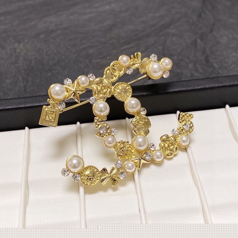 Ch*el brooches